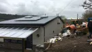 The incomplete concrete block retaining wall at Swainswick School collapsed after aggregate was placed against it.
