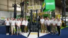 Combilift staff celebrate The 100,000th Combilift forklift, a golden Combi-CBE, was unveiled at IMHX 2025 in Birmingham.