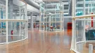 The glass canopy surrounding the outside escalators at the Centre Pompidou in Paris has been reused to create office space. (Image: Alexandre Attias)