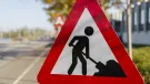 A men at work sign
