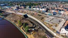 An aerial photo of the the Stockton Waterfront Urban Park. with the town in the background